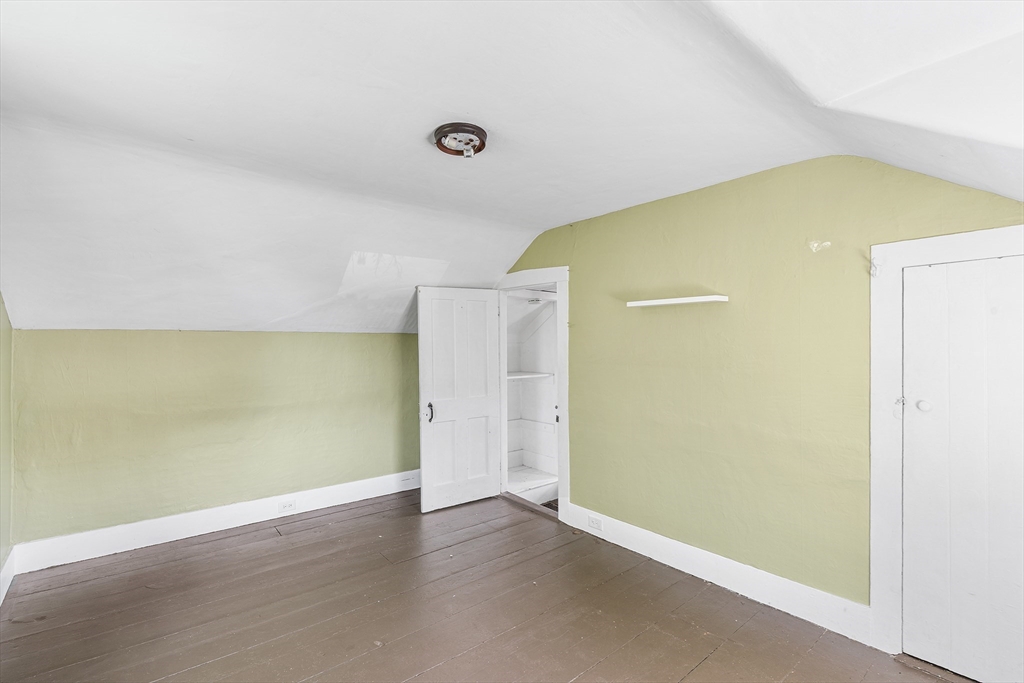 13 Maple Street Easthampton, MA 01027 - Photo 22 of 36 an empty room with wooden floor