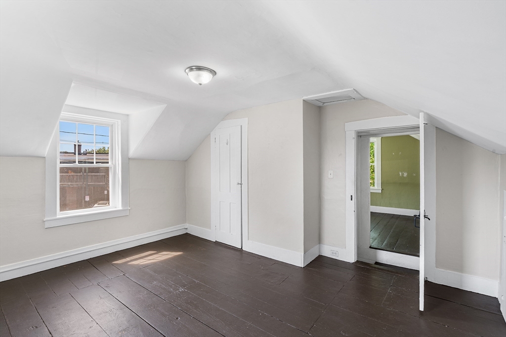 13 Maple Street Easthampton, MA 01027 - Photo 25 of 36 an empty room with wooden floor and windows