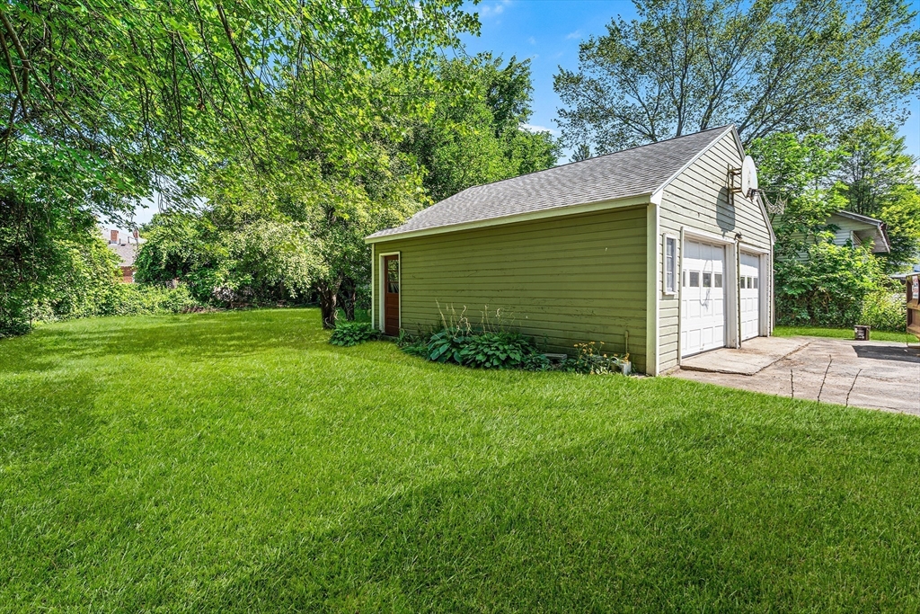 13 Maple Street Easthampton, MA 01027 - Photo 28 of 36 a view of a backyard with barn and large trees