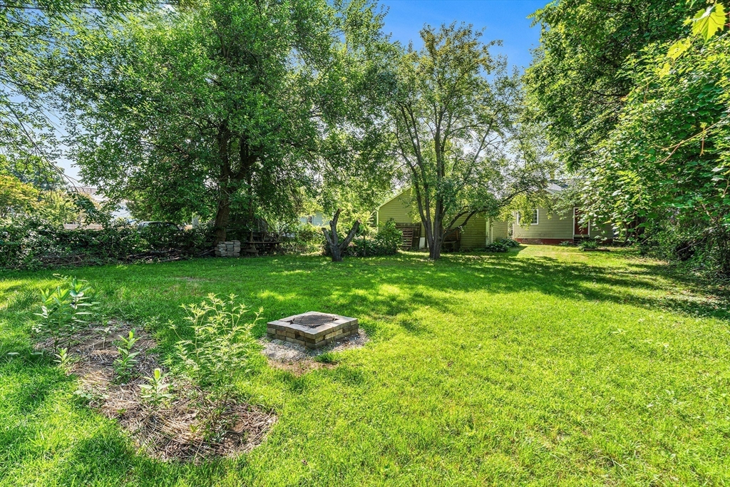 13 Maple Street Easthampton, MA 01027 - Photo 29 of 36 a backyard of a house with lots of green space