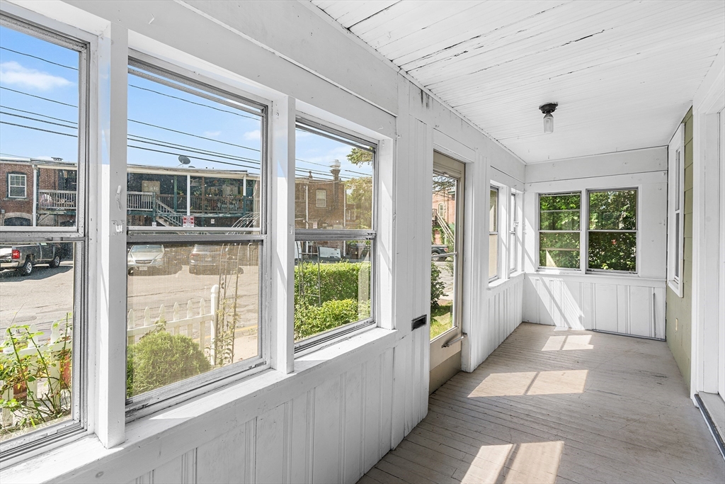 13 Maple Street Easthampton, MA 01027 - Photo 3 of 36 a large room with a large window and front door