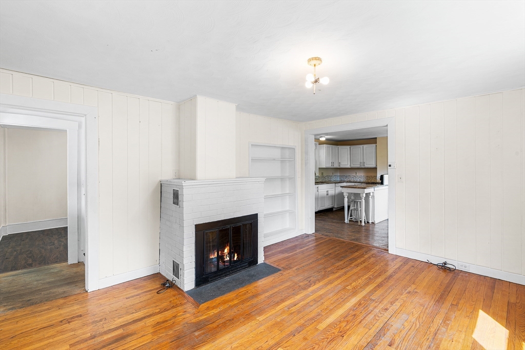 13 Maple Street Easthampton, MA 01027 - Photo 5 of 36 a living room with furniture and a fireplace