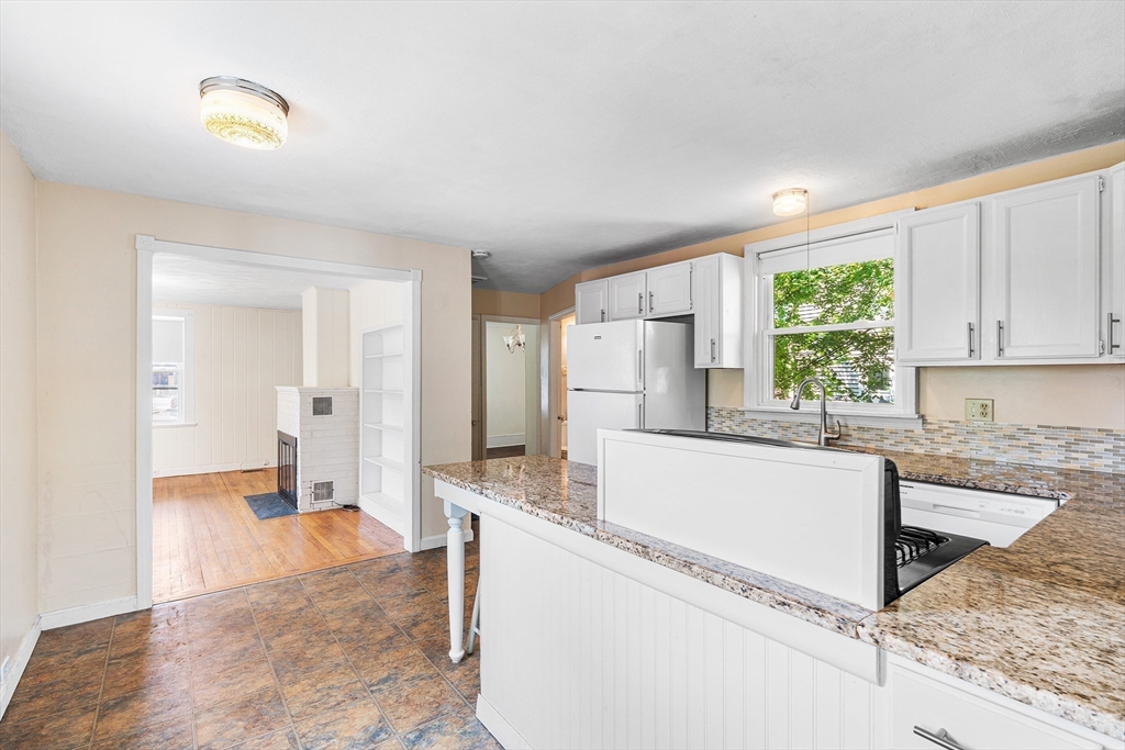 13 Maple Street Easthampton, MA 01027 - Photo 8 of 36 a living room with stainless steel appliances granite countertop a refrigerator sink and cabinets
