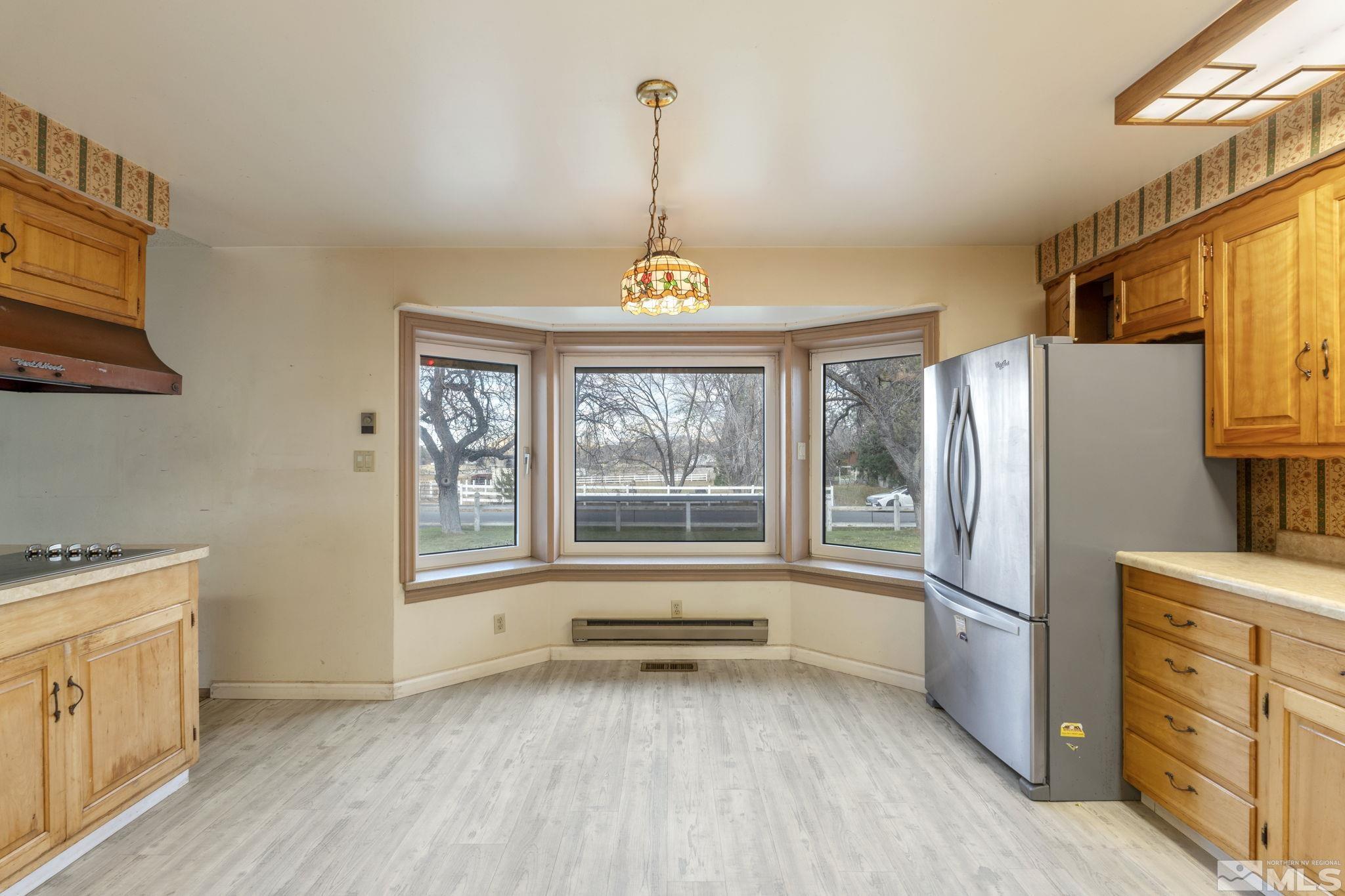 1631 Eli Drive Reno, NV 89511 - Photo 11 of 40 a kitchen with window and refrigerator