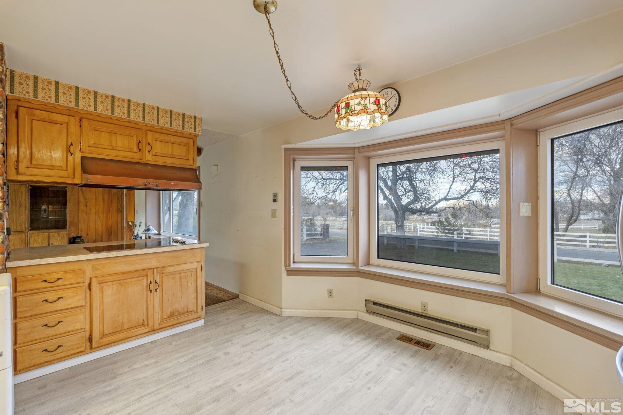 1631 Eli Drive Reno, NV 89511 - Photo 12 of 40 a view of a kitchen with a sink and dishwasher next to a window