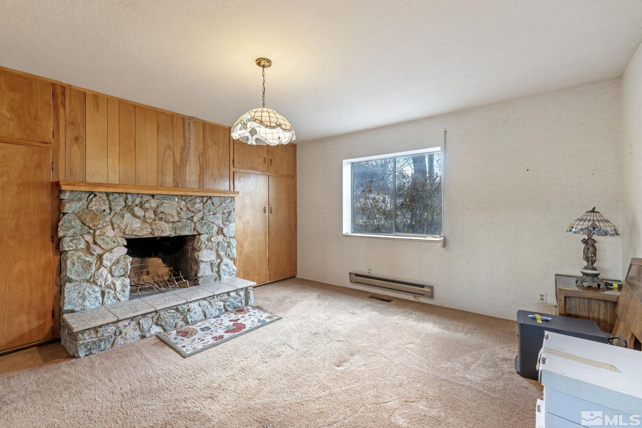 1631 Eli Drive Reno, NV 89511 - Photo 23 of 40 a living room with furniture and a fireplace