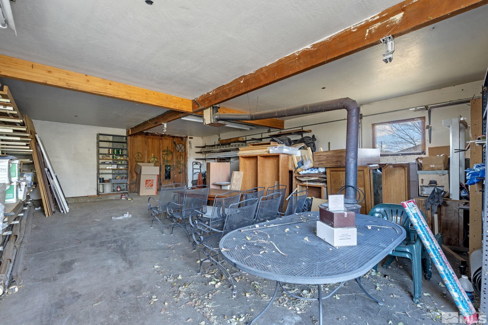 1631 Eli Drive Reno, NV 89511 - Photo 27 of 40 a dining room with furniture a lamp and livingroom