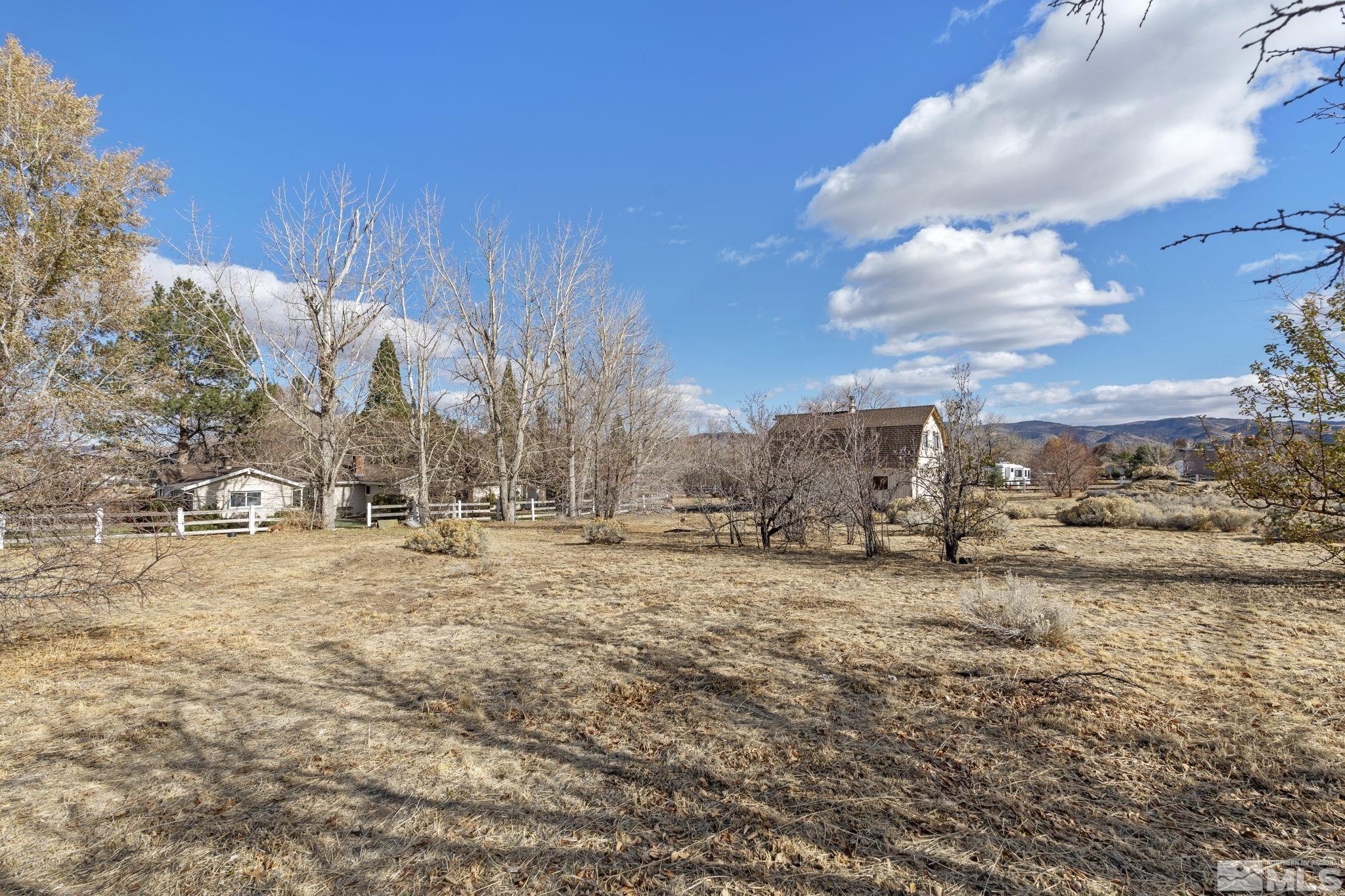 1631 Eli Drive Reno, NV 89511 - Photo 33 of 40 a view of a dry yard with wooden fence
