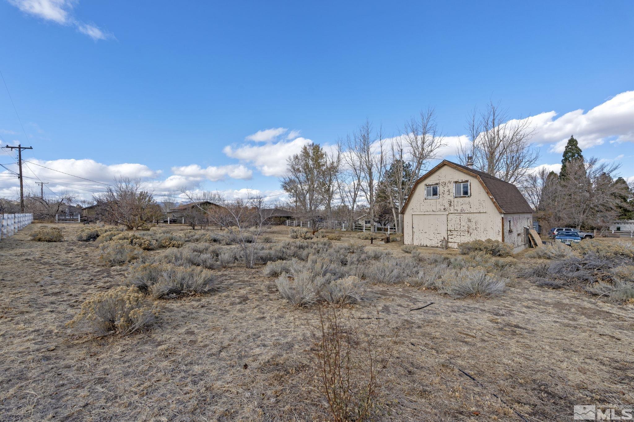 1631 Eli Drive Reno, NV 89511 - Photo 35 of 40 a view of a dry yard with wooden fence