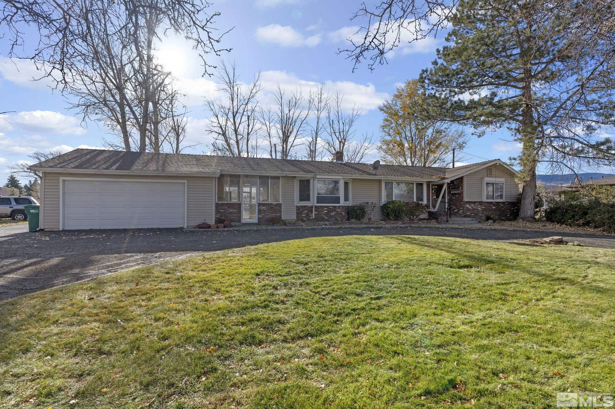 1631 Eli Drive Reno, NV 89511 - Photo 5 of 40 a house with swimming pool in front of it