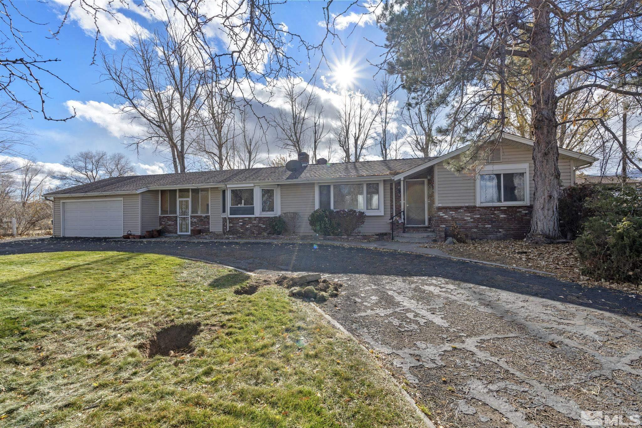 1631 Eli Drive Reno, NV 89511 - Photo 6 of 40 a front view of a house with a yard
