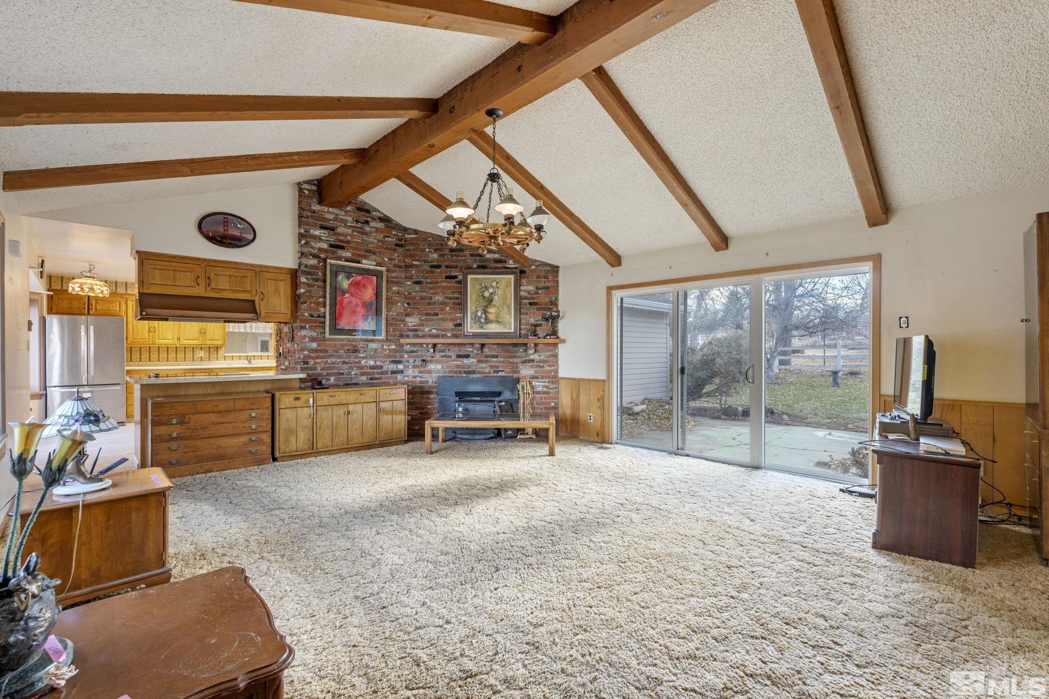 1631 Eli Drive Reno, NV 89511 - Photo 8 of 40 a room with furniture and a flat screen tv