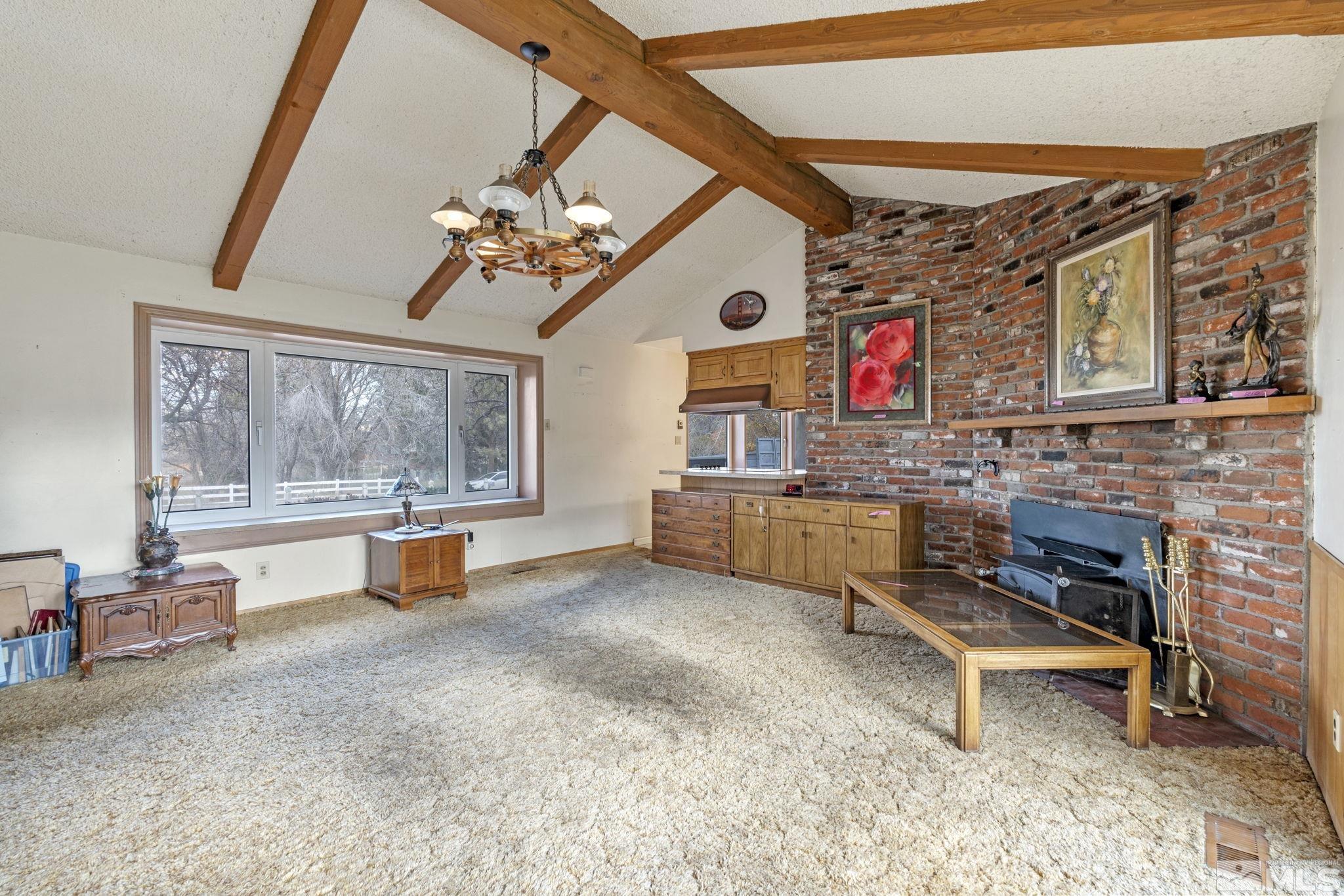 1631 Eli Drive Reno, NV 89511 - Photo 9 of 40 a view of livingroom with furniture and a fireplace