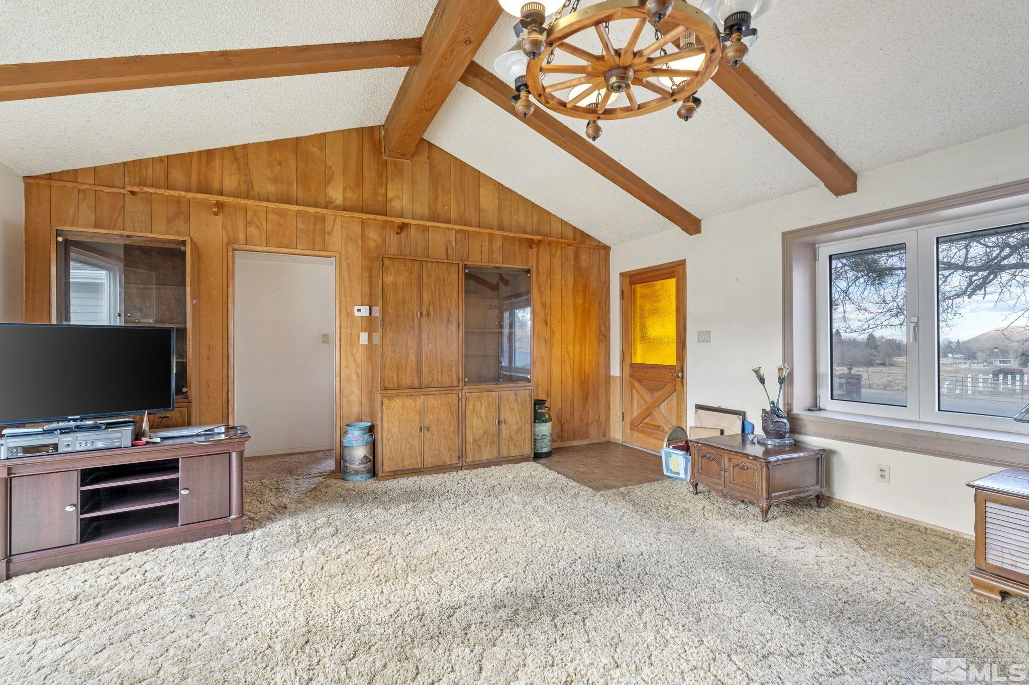 1631 Eli Drive Reno, NV 89511 - Photo 10 of 40 a living room with furniture and a flat screen tv