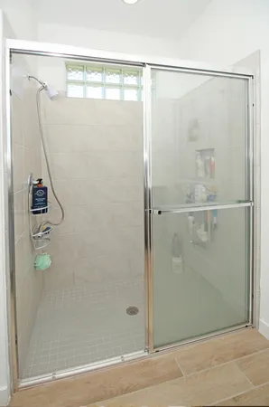 a bathroom with a shower and toilet