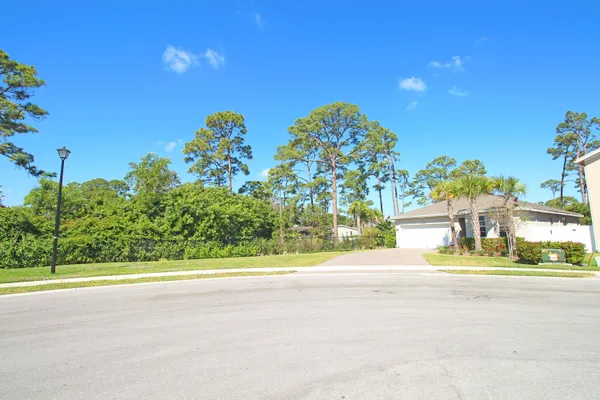 a hallway with dining table and chairs