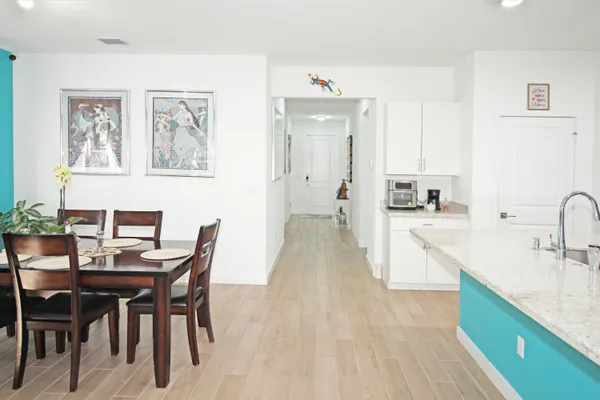 a kitchen with a table and chairs in it
