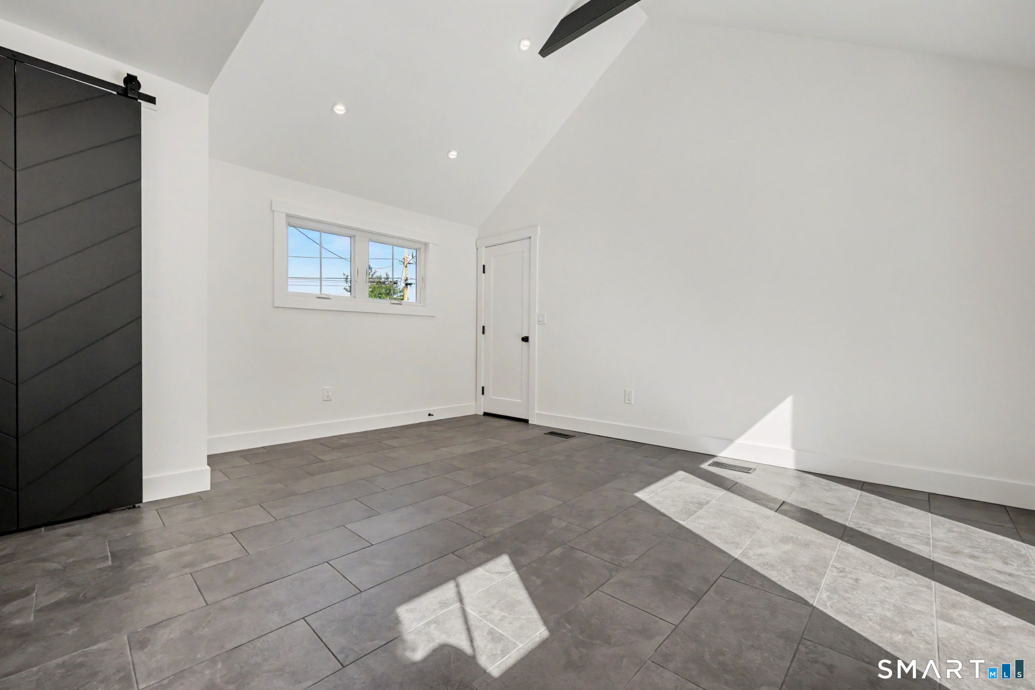 91 Lockwood Road Fairfield, CT 06825 - Photo 16 of 38 an empty room with windows