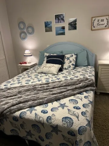 a bedroom with a bed and a dresser
