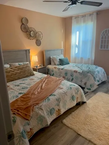 a bedroom with bed and a table