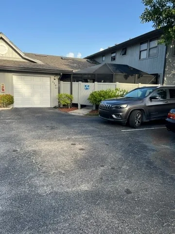 a car parked in front of a house