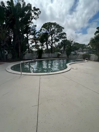 a view of swimming pool with patio