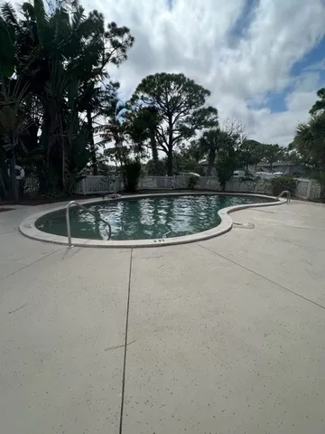a view of swimming pool with patio