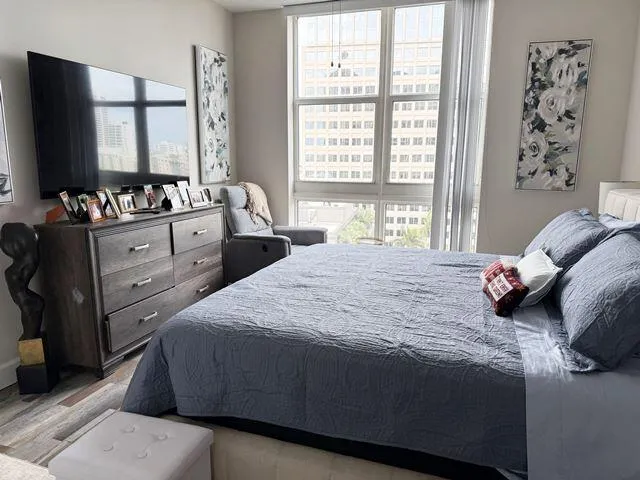 a bedroom with a bed and a dresser