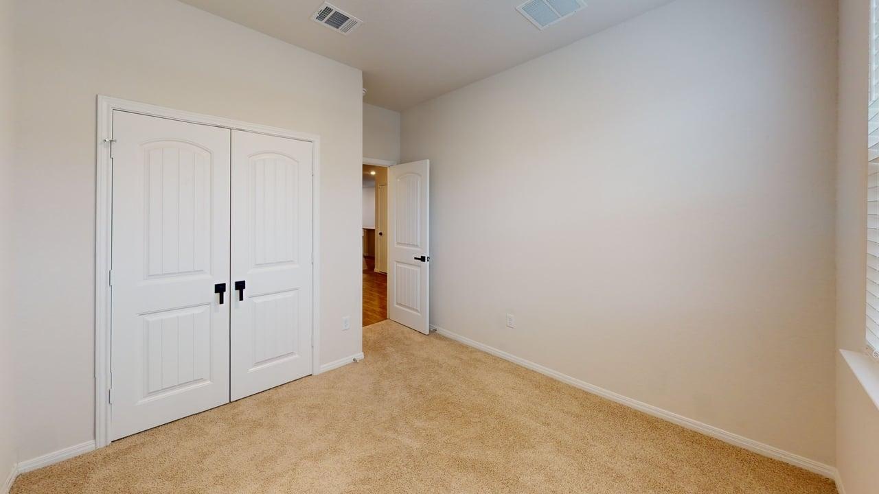 245 Brooklyn Drive Georgetown, TX 78626 - Photo 12 of 23 Unfurnished bedroom with carpet floors and a closet