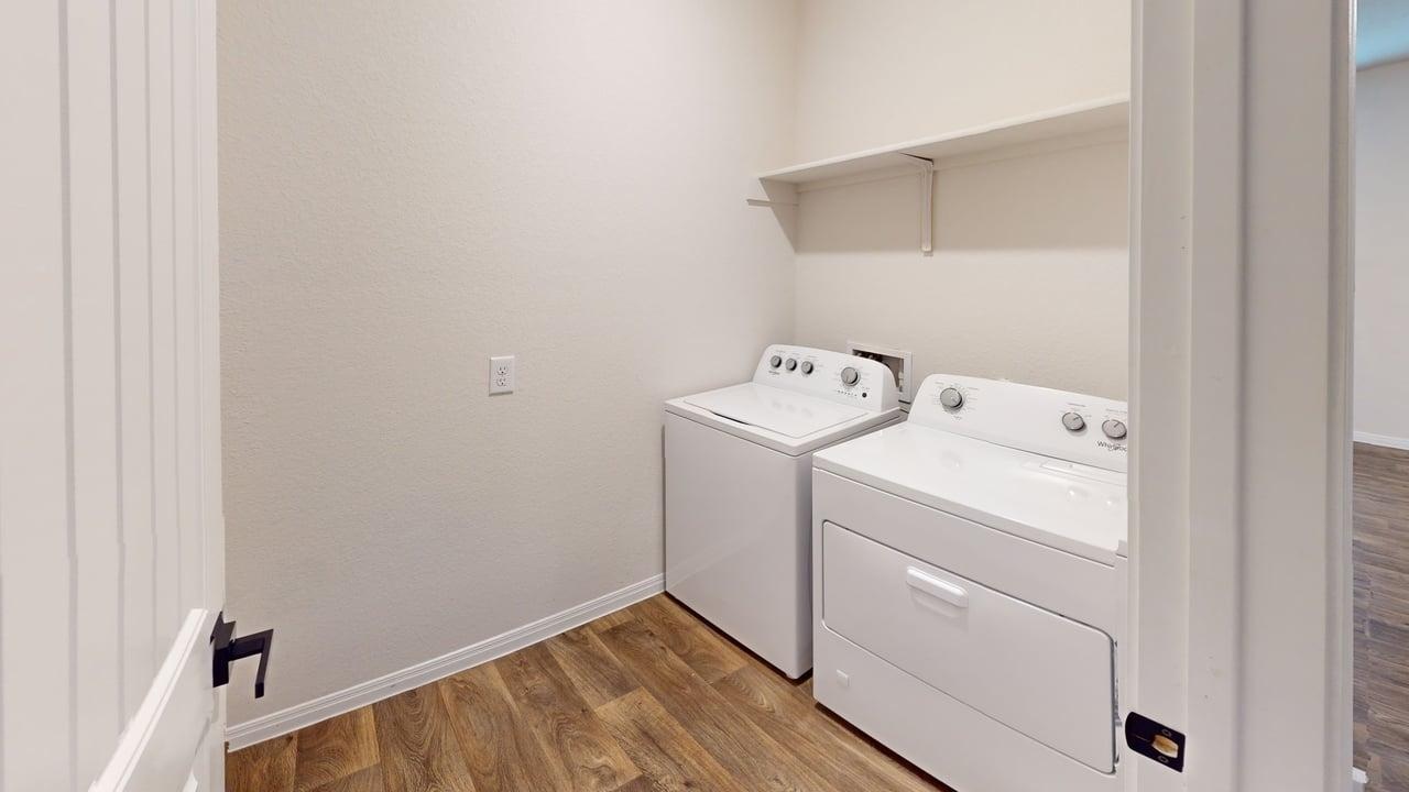 245 Brooklyn Drive Georgetown, TX 78626 - Photo 19 of 23 Laundry area with wood finished floors and washing machine and dryer