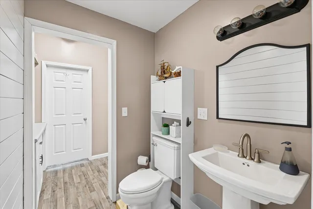 a view of a bathroom from a hallway