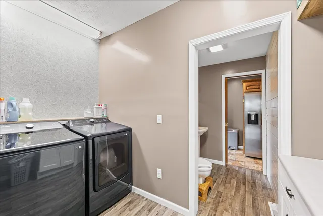 a living room with furniture a ceiling fan and a window