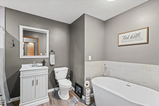 a living room with lots of furniture and a flat screen tv