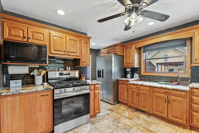 a dinning area with pool table and chairs