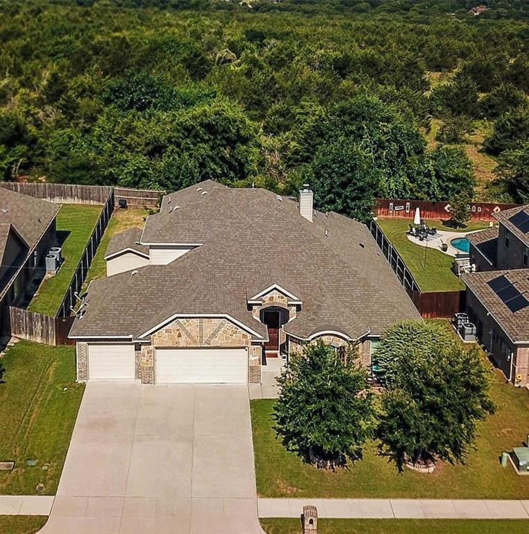 5809 Yellow Rose Court Midlothian, TX 76065 - Photo 2 of 33 Stone and brick exterior residence featuring an attached two-car garage, a concrete driveway, and a shingled roof
