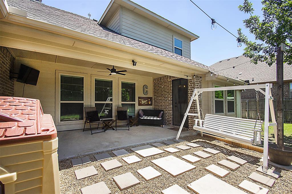 5809 Yellow Rose Court Midlothian, TX 76065 - Photo 26 of 33 Covered concrete patio with ceiling fan