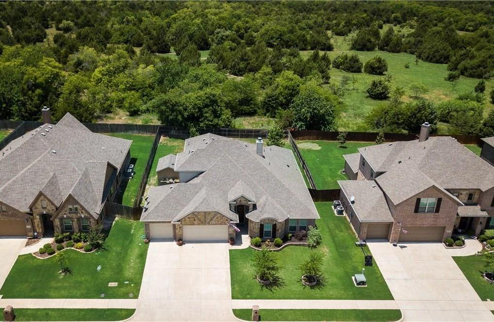 5809 Yellow Rose Court Midlothian, TX 76065 - Photo 29 of 33 Contemporary residence featuring a stone and brick facade, a two-car garage, and an extended driveway