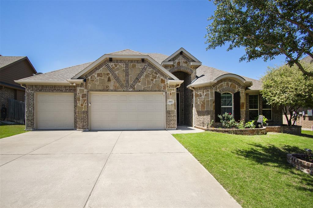 5809 Yellow Rose Court Midlothian, TX 76065 - Photo 30 of 33 Stone and brick facade with a two-car garage and concrete driveway