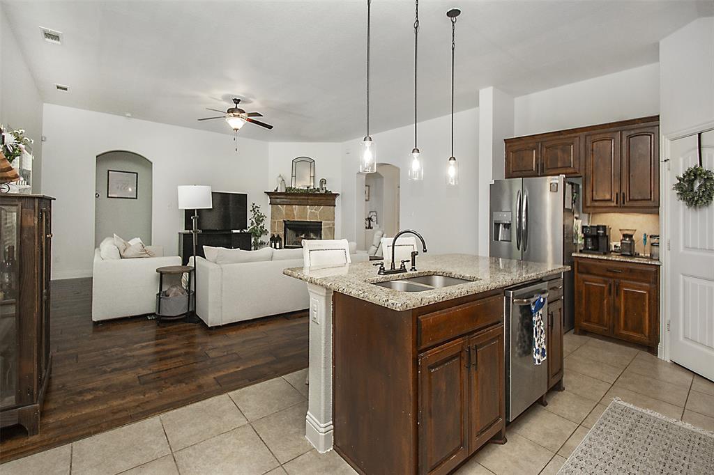 5809 Yellow Rose Court Midlothian, TX 76065 - Photo 5 of 33 Spacious kitchen island with granite countertop and dual basin sink