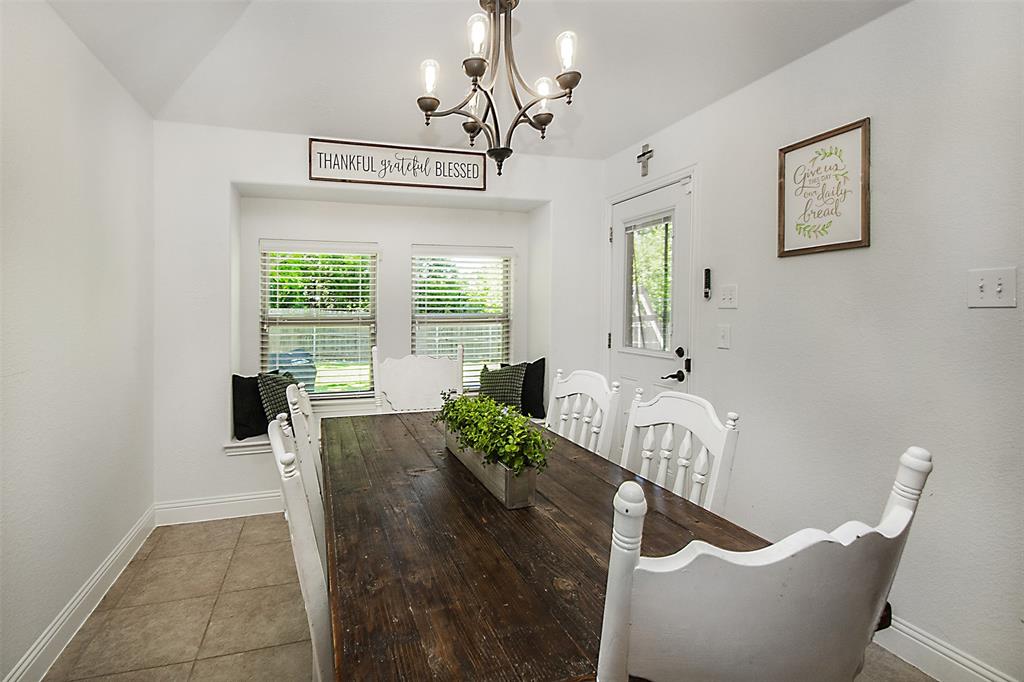 5809 Yellow Rose Court Midlothian, TX 76065 - Photo 10 of 33 Light-filled room featuring a bay window with integrated seating, recessed window blinds, and a vaulted ceiling