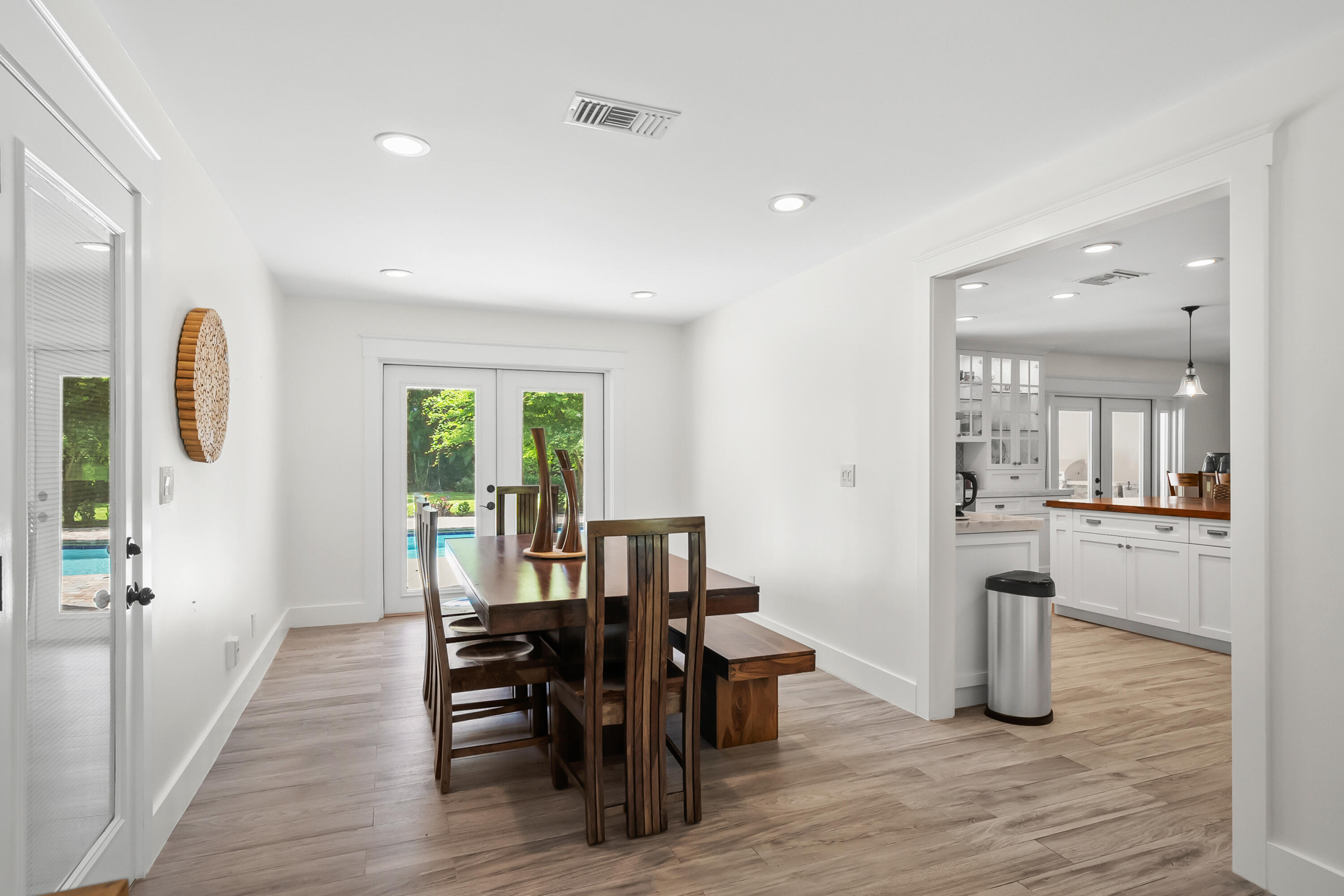 3 Mandalay Road Sewall's Point, FL 34996 - Photo 16 of 46 a view of a dining room with furniture window and wooden floor