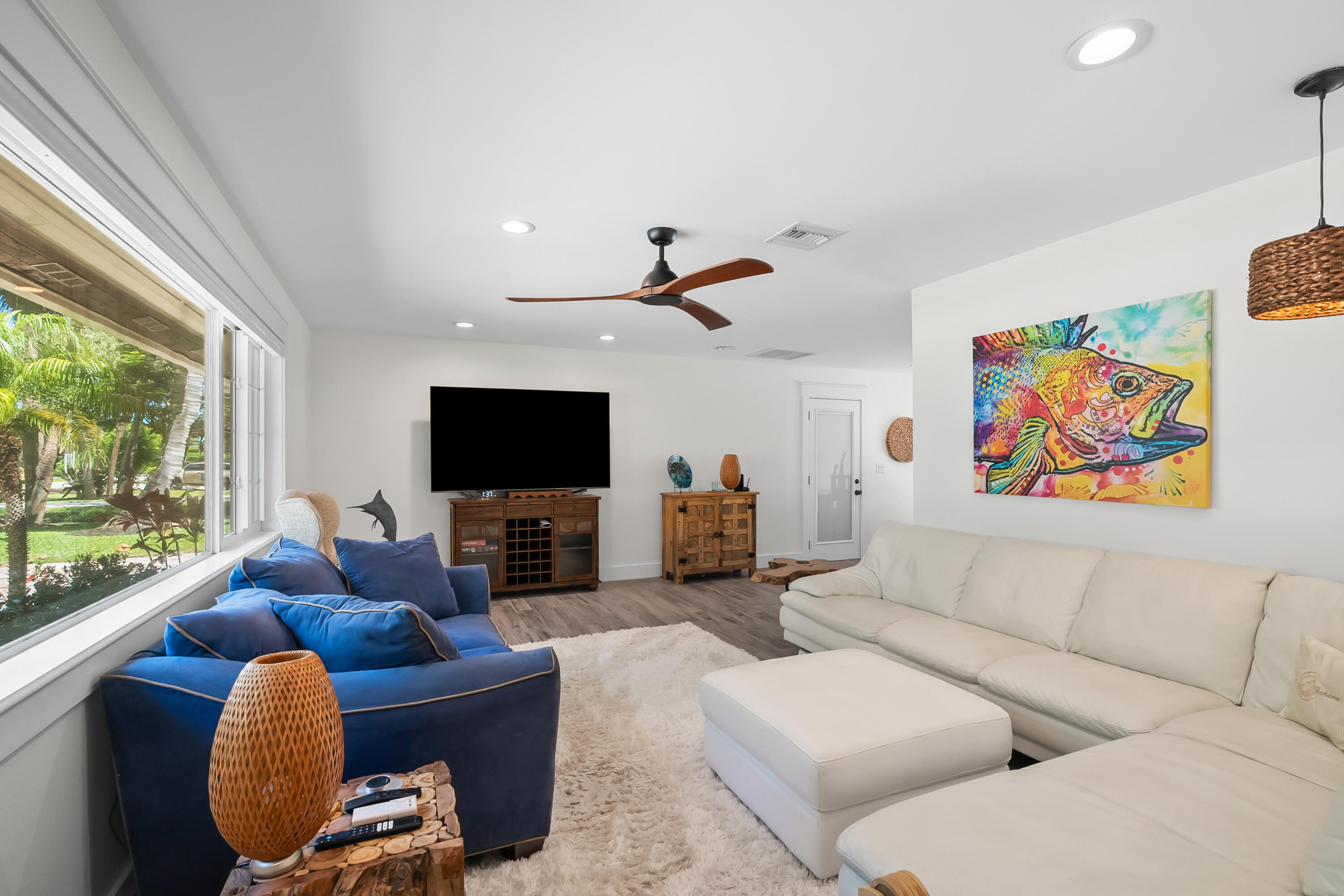 3 Mandalay Road Sewall's Point, FL 34996 - Photo 18 of 46 a living room with furniture and a flat screen tv