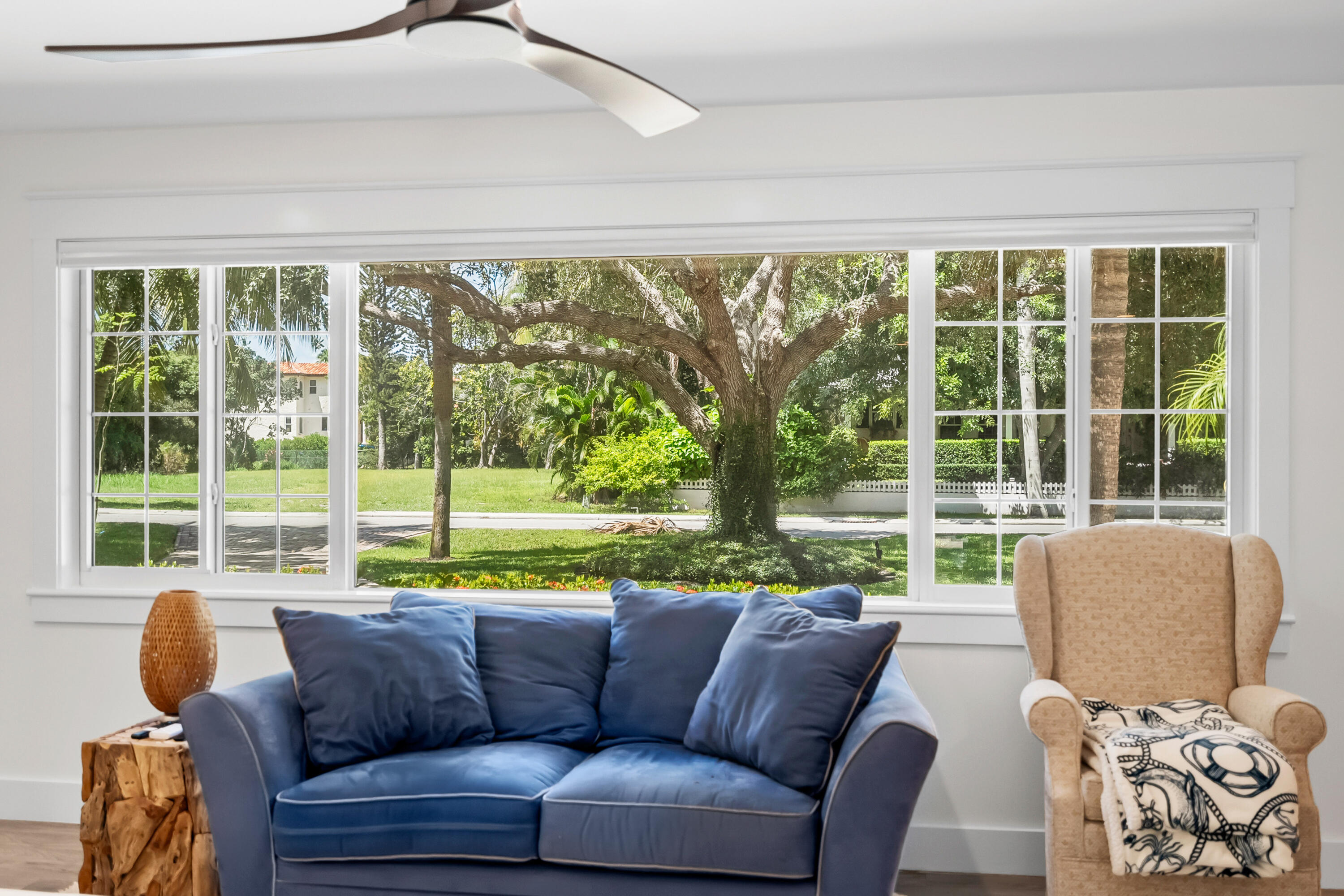 3 Mandalay Road Sewall's Point, FL 34996 - Photo 19 of 46 a living room with couch and a large window