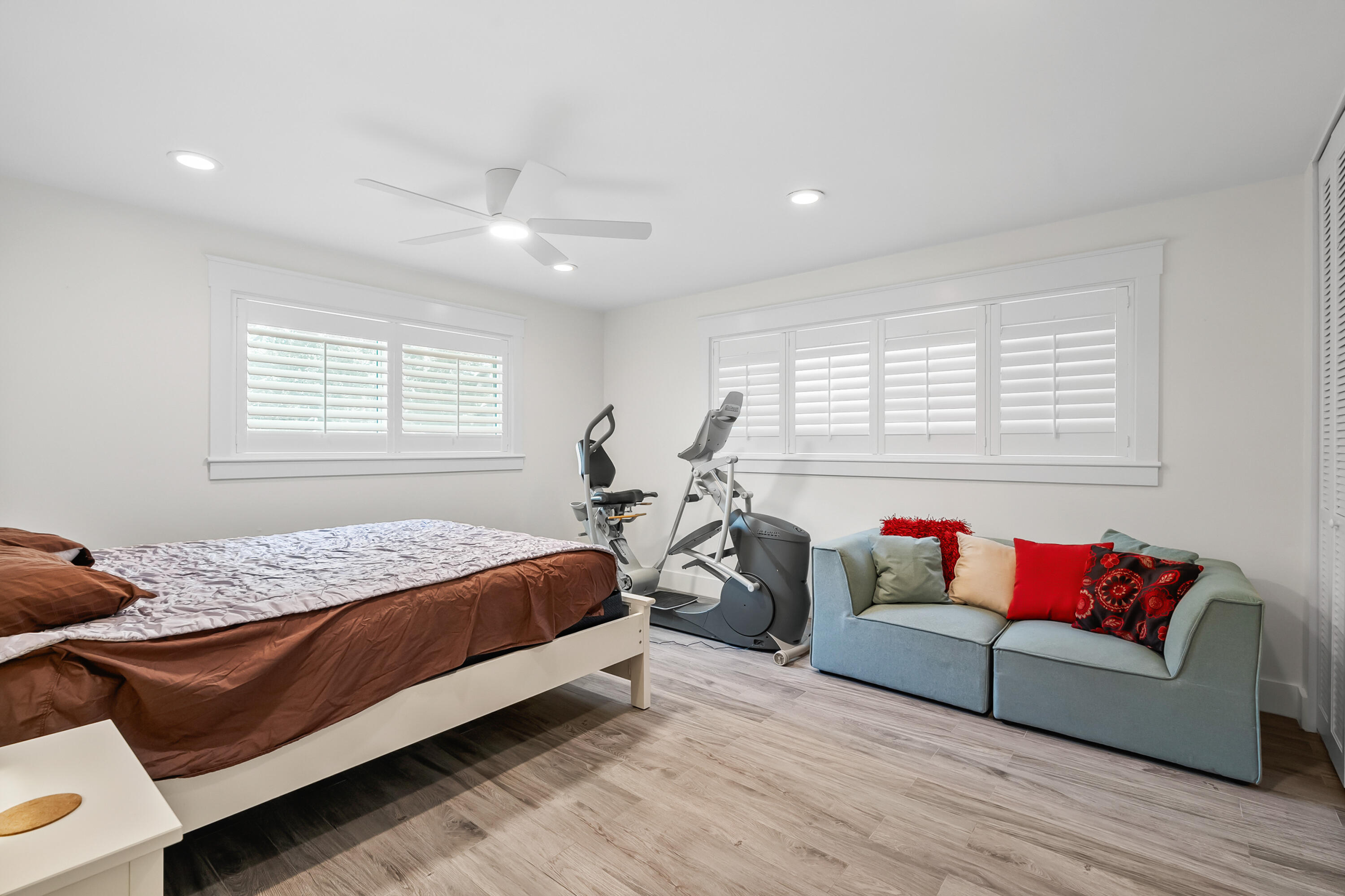 3 Mandalay Road Sewall's Point, FL 34996 - Photo 21 of 46 a bedroom with bed couch and window