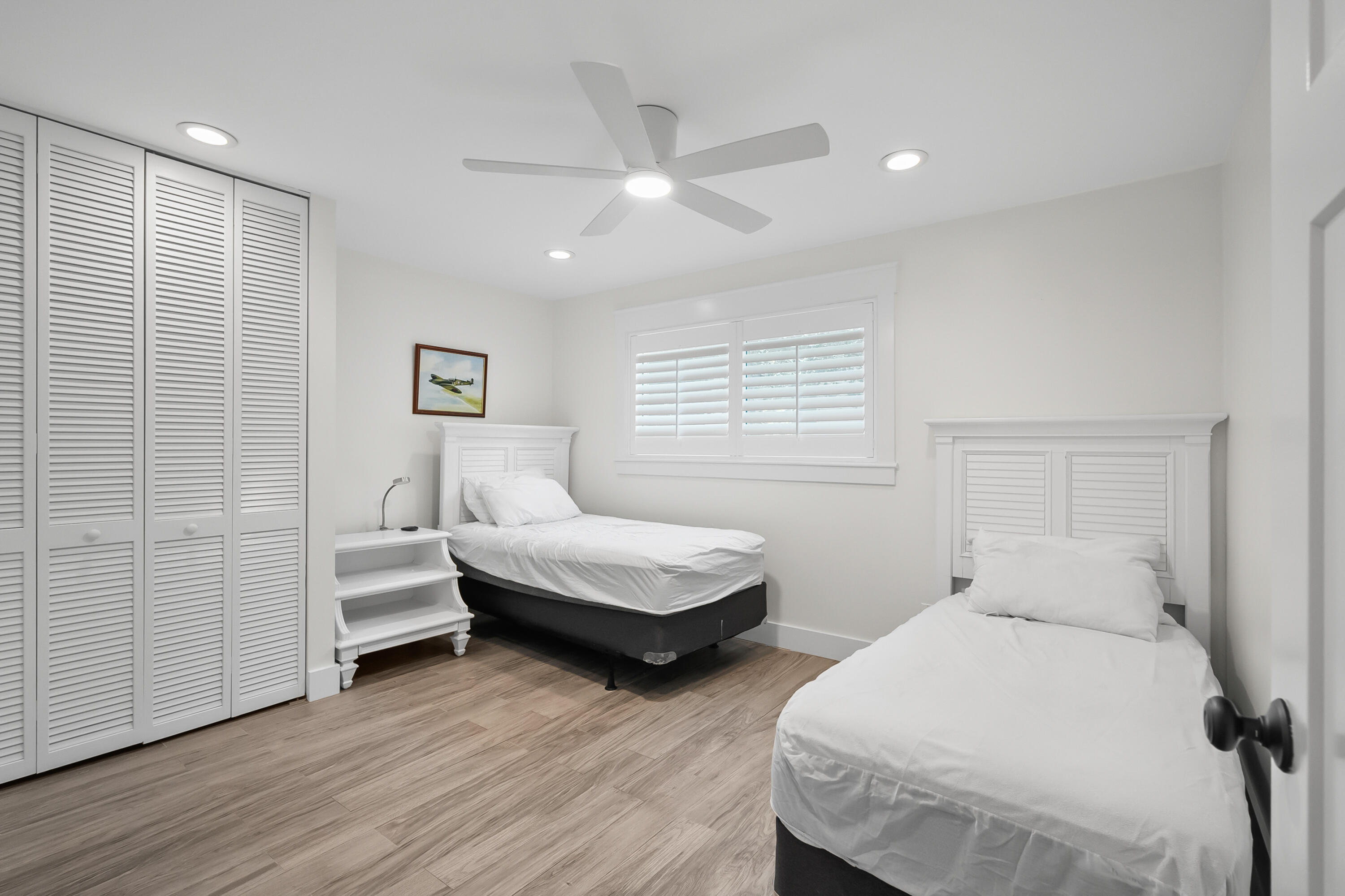 3 Mandalay Road Sewall's Point, FL 34996 - Photo 22 of 46 a bedroom with two beds and a window