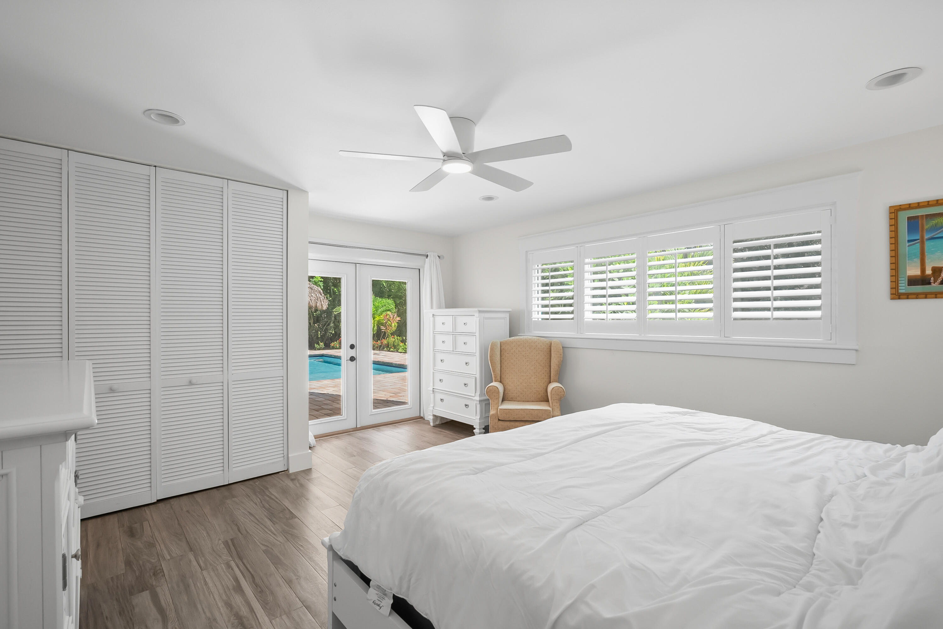 3 Mandalay Road Sewall's Point, FL 34996 - Photo 24 of 46 a bedroom with a large bed and a window