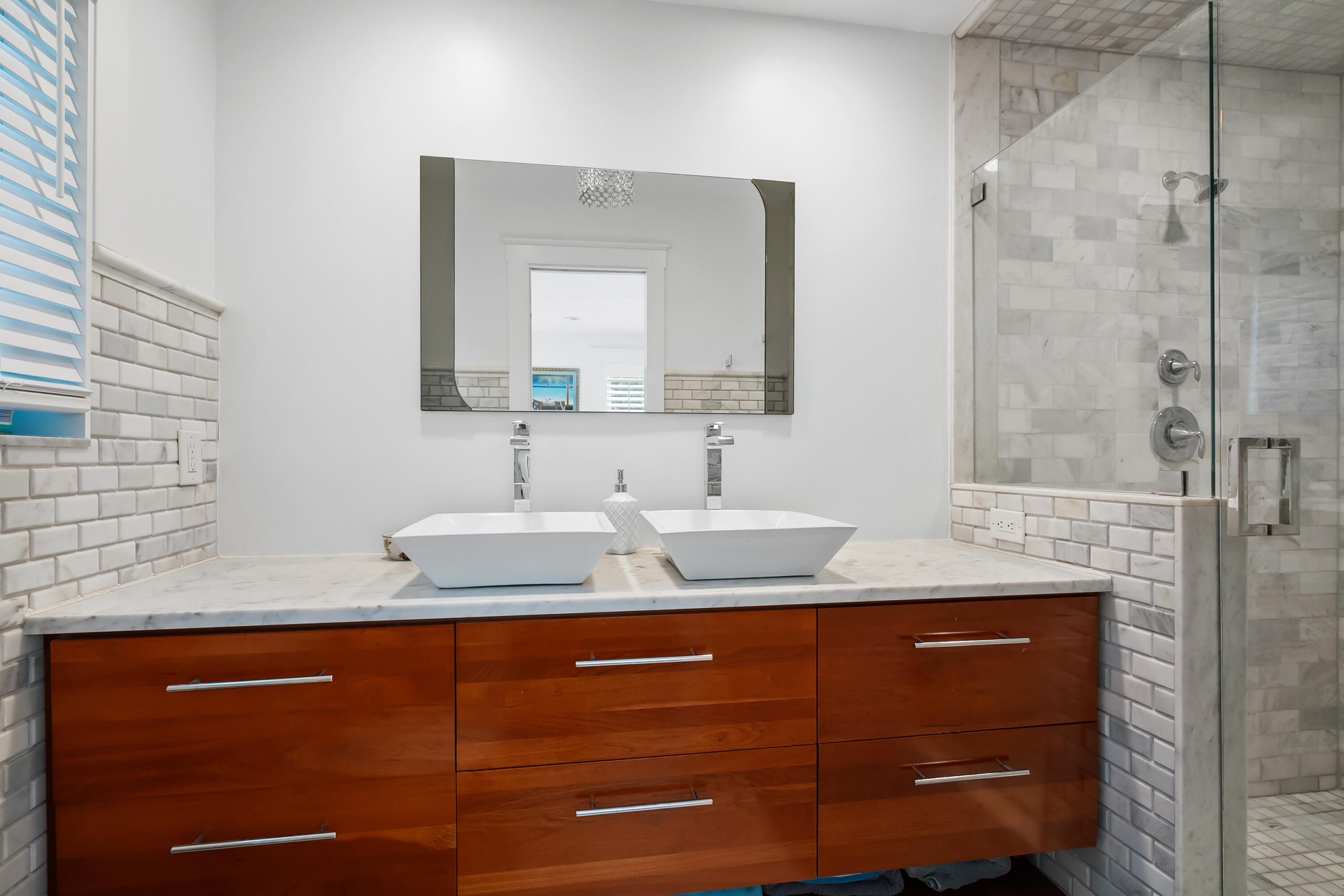 3 Mandalay Road Sewall's Point, FL 34996 - Photo 26 of 46 a bathroom with a granite countertop sink and a mirror