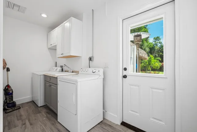 a kitchen with stainless steel appliances granite countertop a stove and a refrigerator