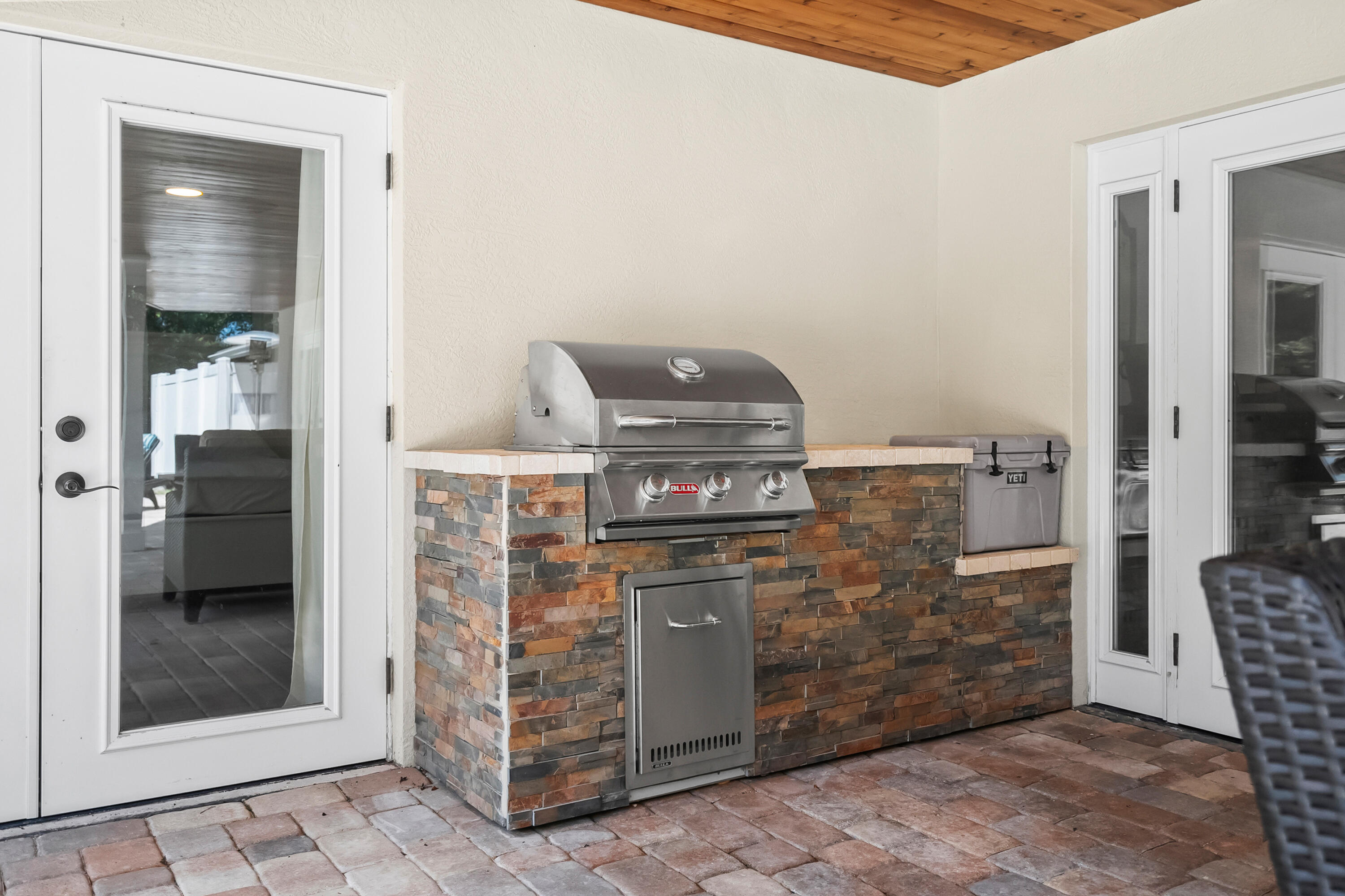 3 Mandalay Road Sewall's Point, FL 34996 - Photo 29 of 46 a kitchen with stainless steel appliances granite countertop a stove and a refrigerator