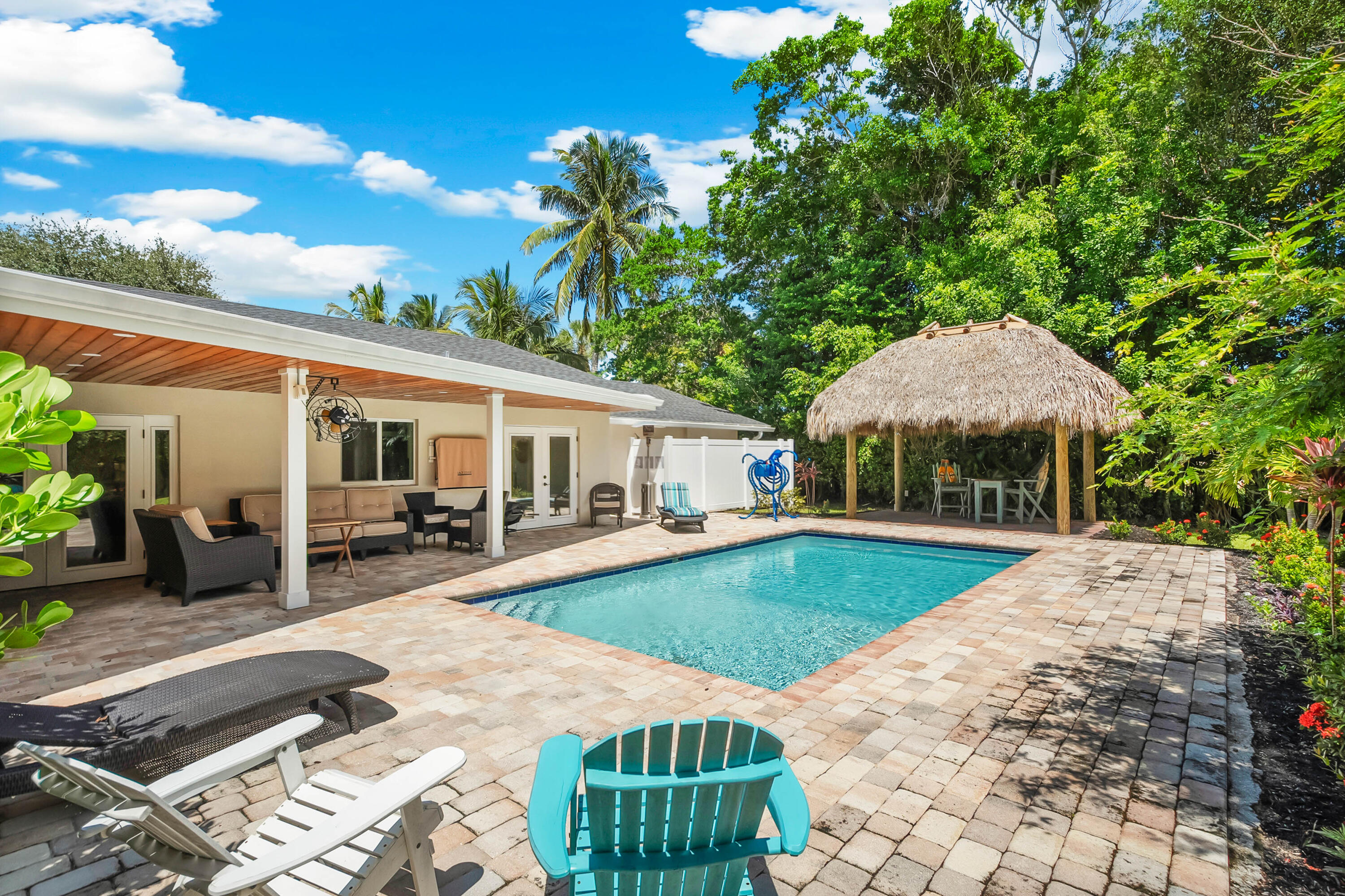 3 Mandalay Road Sewall's Point, FL 34996 - Photo 32 of 46 a front view of a house with garden